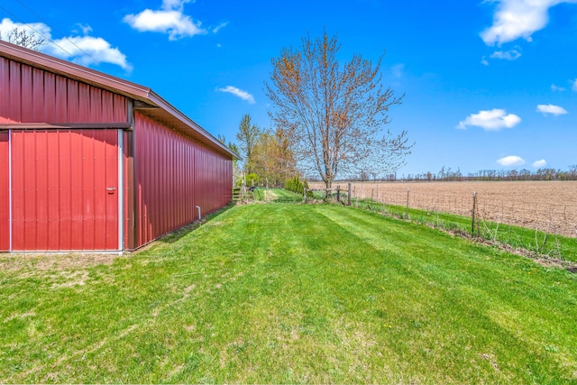 8531 S Waldron Rd, Pittsford, MI 49271 - view of yard with an outdoor structure, fence, an outbuilding, and a rural view
