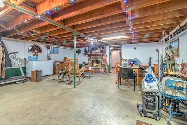 8531 S Waldron Rd, Pittsford, MI 49271 - unfinished basement with a brick fireplace and washer / clothes dryer