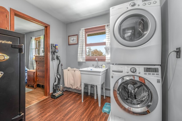 8531 S Waldron Rd, Pittsford, MI 49271 - laundry area with laundry area, dark wood finished floors, and stacked washer / dryer
