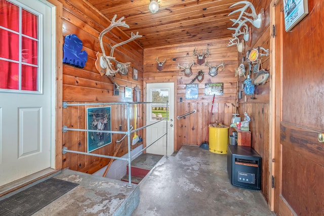 8531 S Waldron Rd, Pittsford, MI 49271 - entrance foyer featuring wood ceiling, concrete flooring, and wooden walls
