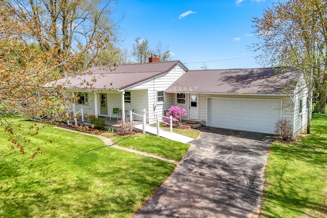 8531 S Waldron Rd, Pittsford, MI 49271 - ranch-style house with a garage, driveway, a front yard, and covered porch
