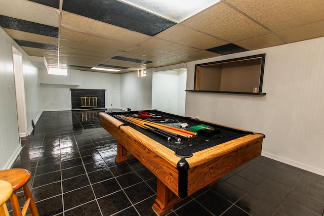 playroom featuring a fireplace, tile patterned floors, a paneled ceiling, baseboards, and pool table