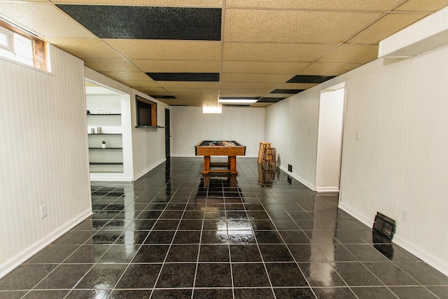 rec room with baseboards, a drop ceiling, tile patterned floors, built in shelves, and billiards