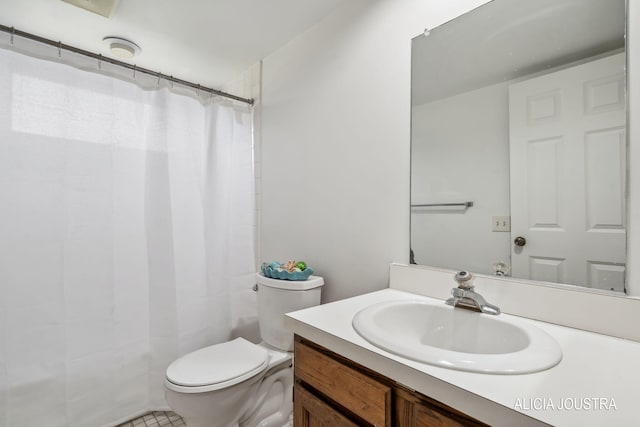 bathroom with vanity, tile patterned floors, a shower with curtain, and toilet