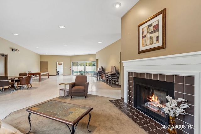 living area featuring recessed lighting and a fireplace