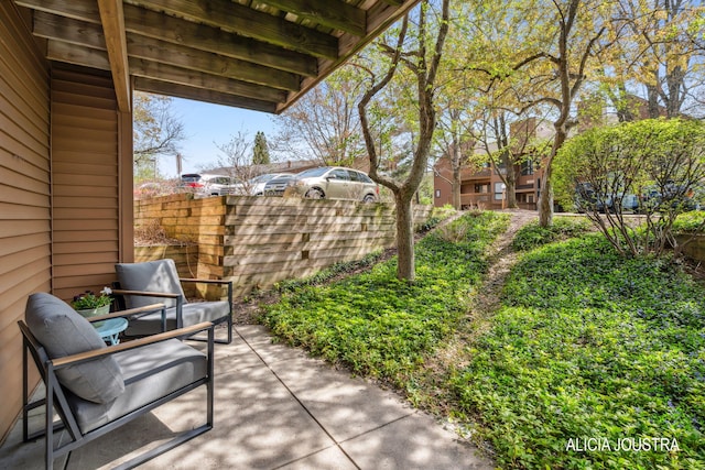 view of patio featuring fence