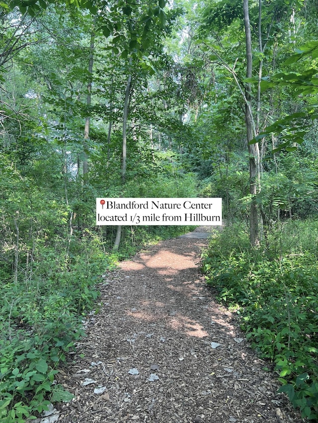 exterior space featuring a wooded view