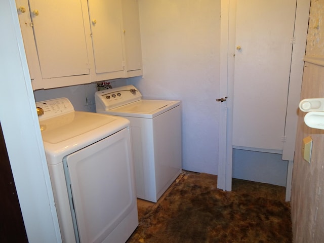 washroom featuring cabinet space and washer and dryer