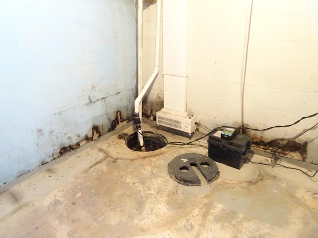 below grade area with concrete block wall