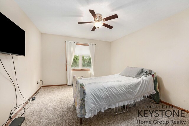 bedroom featuring carpet flooring, baseboards, and ceiling fan