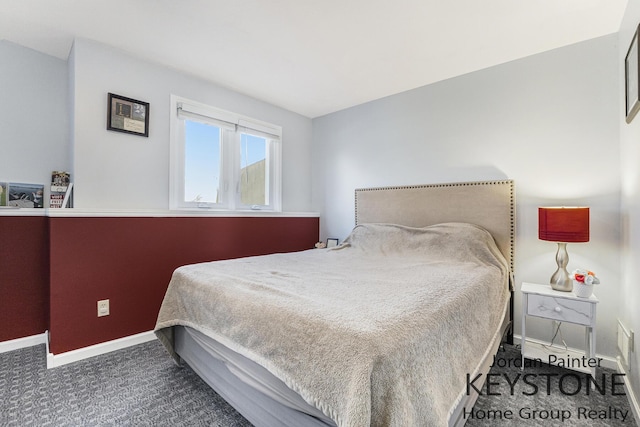 bedroom featuring carpet flooring and baseboards