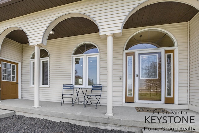doorway to property featuring covered porch