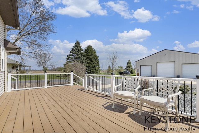 wooden deck featuring a detached garage