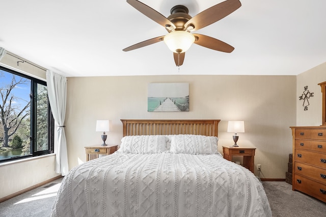 carpeted bedroom with a ceiling fan, baseboards, and visible vents