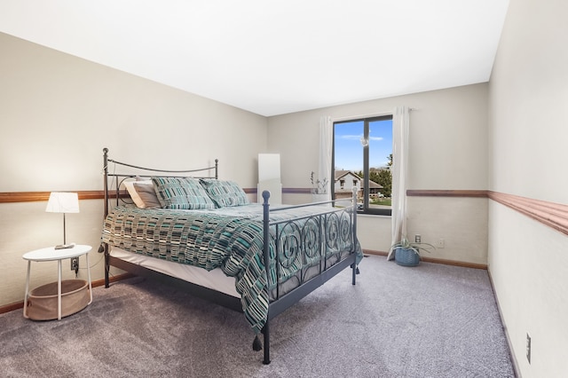bedroom with baseboards and carpet flooring