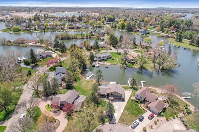 birds eye view of property featuring a water view and a residential view