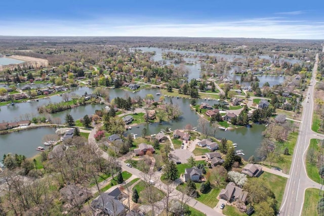bird's eye view featuring a water view and a residential view