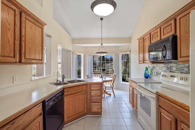 kitchen with brown cabinetry, a sink, lofted ceiling, and black appliances