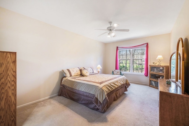 bedroom featuring carpet floors, baseboards, and ceiling fan