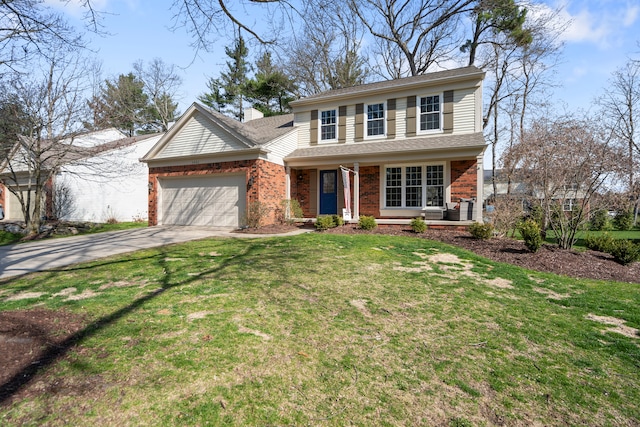 traditional home with an attached garage, a front yard, driveway, and brick siding
