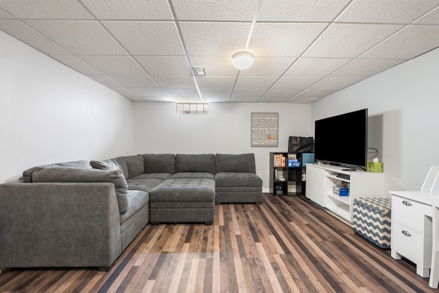 living area featuring visible vents, dark wood finished floors, and a drop ceiling