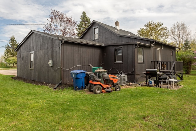 view of property exterior with a chimney and a yard