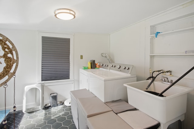 laundry room with washer and dryer, laundry area, a sink, and tile patterned floors