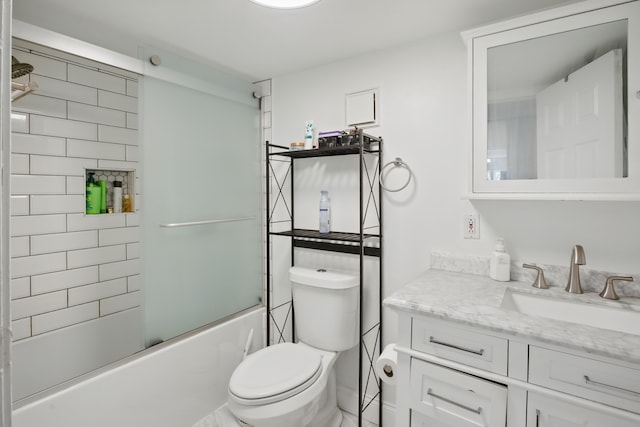 full bath featuring toilet, enclosed tub / shower combo, and vanity