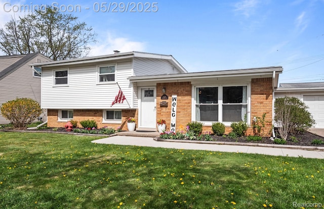 1128 Braeview Dr, Howell, MI 48843 - split level home with brick siding and a front lawn