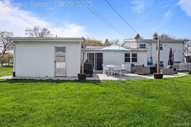 1128 Braeview Dr, Howell, MI 48843 - rear view of property featuring outdoor lounge area, a patio, and a chimney