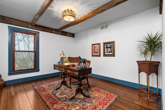 home office featuring visible vents, baseboards, hardwood / wood-style flooring, and beamed ceiling