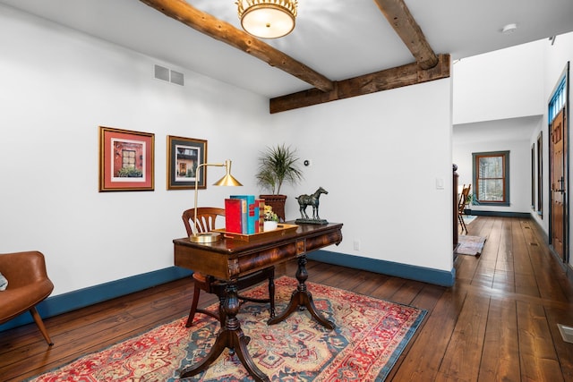 office space featuring baseboards, wood-type flooring, and visible vents