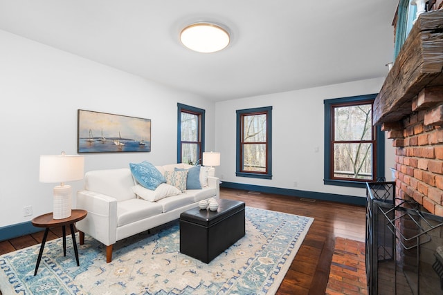living room with baseboards and wood finished floors