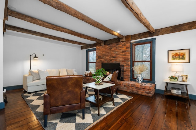living room featuring baseboards, a fireplace, beam ceiling, and hardwood / wood-style floors