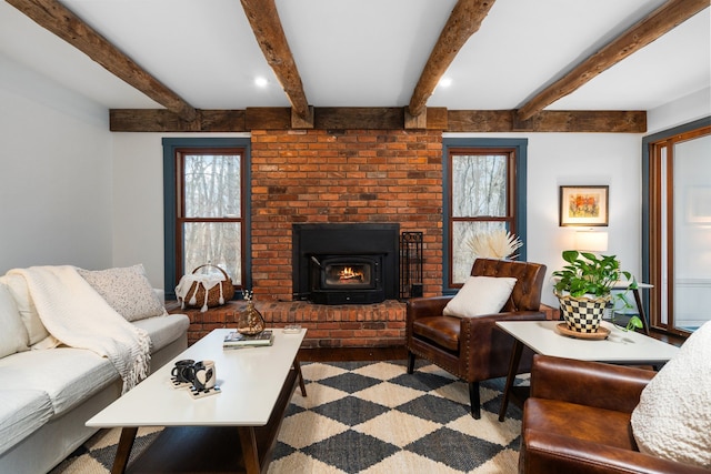 living area with recessed lighting, a healthy amount of sunlight, and a fireplace
