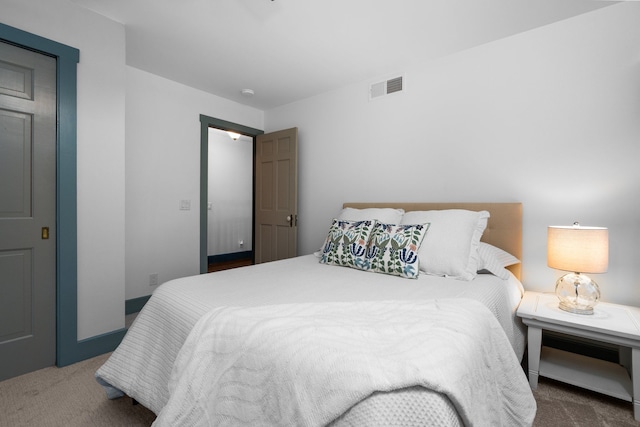 carpeted bedroom with visible vents