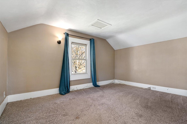 bonus room with baseboards, attic access, carpet flooring, and lofted ceiling