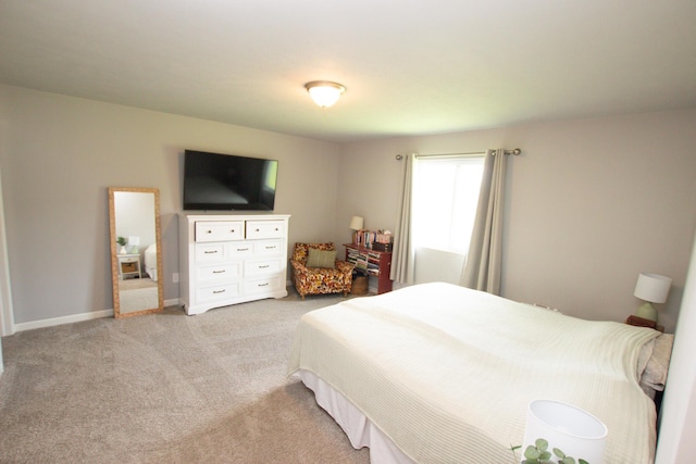 bedroom with light carpet