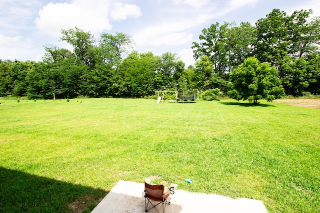 view of yard with a trampoline