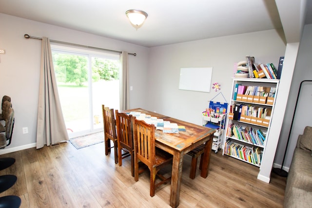 dining space featuring light wood-type flooring