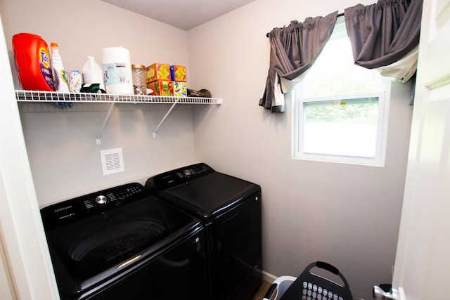 clothes washing area with laundry area and independent washer and dryer
