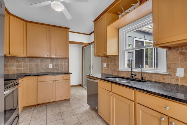 kitchen with light tile patterned flooring, appliances with stainless steel finishes, a sink, a ceiling fan, and decorative backsplash