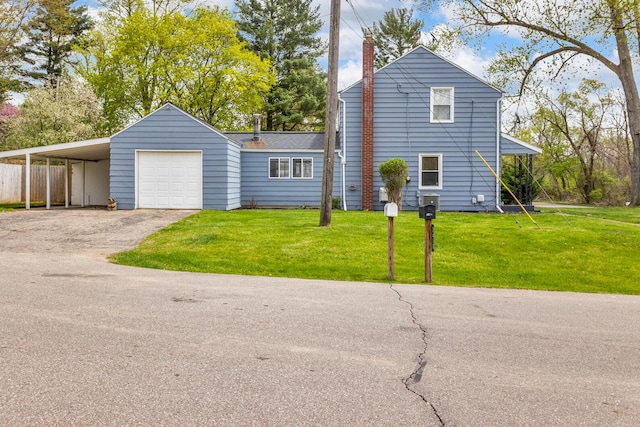 view of front of house featuring fence, a chimney, driveway, and a front yard