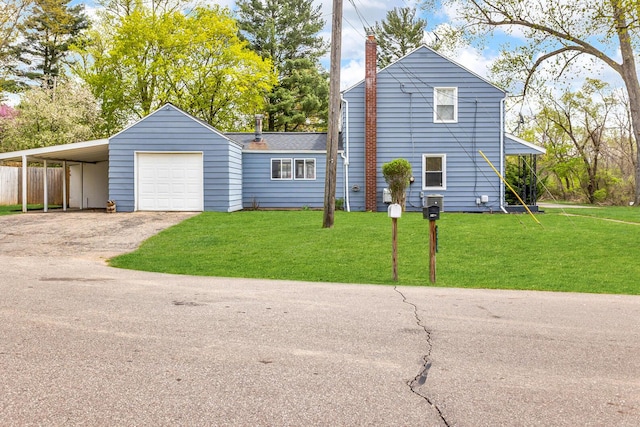 2408 Cobb Rd, Jackson, MI 49203 - view of front of house with a chimney and driveway