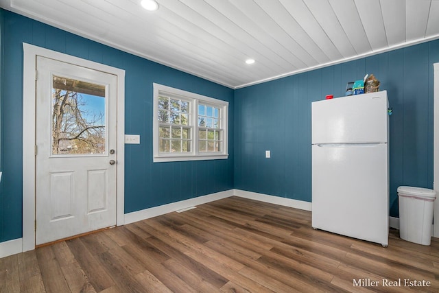 729 E Madison St, Hastings, MI 49058 - unfurnished dining area with recessed lighting, baseboards, and wood finished floors