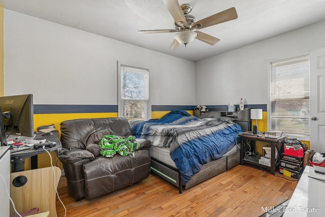 729 E Madison St, Hastings, MI 49058 - bedroom with ceiling fan, multiple windows, and wood finished floors