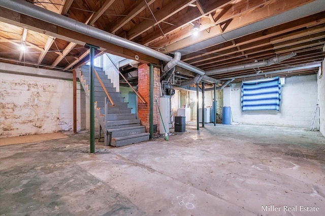 729 E Madison St, Hastings, MI 49058 - basement featuring stairway and water heater