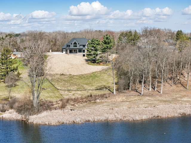 view of subject property with a nearby body of water