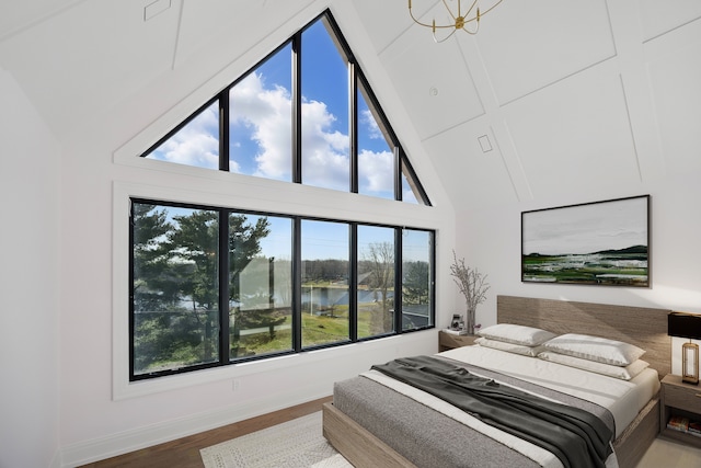 3281 Chickering Ln, Bloomfield Hills, MI 48302 - bedroom featuring a water view, high vaulted ceiling, wood finished floors, and baseboards