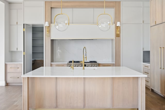 kitchen featuring light wood-style floors, light countertops, modern cabinets, and white cabinets